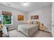 Bedroom featuring a large window and a comfortable bed setup at 6445 Lucent Ln, Atlanta, GA 30328