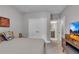 Bedroom featuring a comfortable bed setup and entertainment center at 6445 Lucent Ln, Atlanta, GA 30328