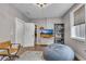 Bright bedroom with hardwood floors, modern furniture, and a view to a closet at 6445 Lucent Ln, Atlanta, GA 30328