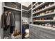 Custom closet featuring shelving, drawers, and hanging space for clothes and shoes at 6445 Lucent Ln, Atlanta, GA 30328