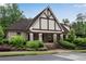 A single story, brown and beige community building surrounded by perfectly manicured green landscaping at 6445 Lucent Ln, Atlanta, GA 30328
