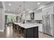 Open-concept kitchen with a center island, stainless steel appliances, and hardwood floors at 6445 Lucent Ln, Atlanta, GA 30328