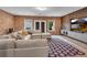 Cozy living room features exposed brick walls, stylish rug, and comfortable sectional sofa at 6445 Lucent Ln, Atlanta, GA 30328