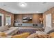 Spacious living room boasts modern console, exposed brick, and contemporary decor at 6445 Lucent Ln, Atlanta, GA 30328