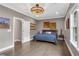 Well-lit main bedroom with hardwood floors, crown molding, and ample natural light at 6445 Lucent Ln, Atlanta, GA 30328