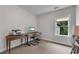 Bright home office with a desk, printer, and large window at 6445 Lucent Ln, Atlanta, GA 30328