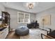 Well-lit home office with desk, chair, beanbag, and a modern aesthetic at 6445 Lucent Ln, Atlanta, GA 30328