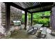 A community outdoor kitchen with a grill and dining area perfect for entertaining friends and neighbors at 6445 Lucent Ln, Atlanta, GA 30328