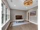 Bright sitting room with hardwood floors and chair at 6445 Lucent Ln, Atlanta, GA 30328