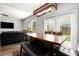 Dining room with a large wooden table and leather chairs at 1295 Aster Ives Dr, Lawrenceville, GA 30045