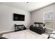 Cozy living room with a TV and neutral decor at 1295 Aster Ives Dr, Lawrenceville, GA 30045