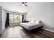 Spacious main bedroom with large windows, offering plenty of natural light and a comfortable atmosphere at 1295 Aster Ives Dr, Lawrenceville, GA 30045