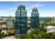 Aerial view of towers surrounded by lush greenery, offering a premier business location at 1461 Bubbling Creek Ne Rd, Brookhaven, GA 30319