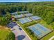 An aerial view of well-maintained tennis courts and parking at the local tennis center at 1461 Bubbling Creek Ne Rd, Brookhaven, GA 30319