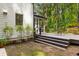 Backyard deck with stairs, potted plants and an outdoor seating area, all beside a home with white siding at 1461 Bubbling Creek Ne Rd, Brookhaven, GA 30319