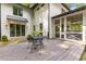 Backyard deck with a patio set, screened porch and white siding, creating an inviting outdoor living space at 1461 Bubbling Creek Ne Rd, Brookhaven, GA 30319
