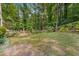 A spacious backyard with a wooden fence, perfect for outdoor activities and privacy at 1461 Bubbling Creek Ne Rd, Brookhaven, GA 30319