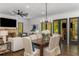 Living room and dining area featuring an elegant chandelier and a beautiful view of the outdoors at 1461 Bubbling Creek Ne Rd, Brookhaven, GA 30319