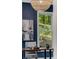 Bright office space featuring a natural fiber pendant light and wooded view at 1461 Bubbling Creek Ne Rd, Brookhaven, GA 30319