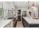 A modern kitchen featuring stone backsplash, stainless appliances, and marble countertops at 1461 Bubbling Creek Ne Rd, Brookhaven, GA 30319