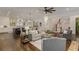 Spacious open-concept living room showcasing a kitchen, dining area, hardwood floors, and a fireplace at 1461 Bubbling Creek Ne Rd, Brookhaven, GA 30319