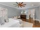 Bright main bedroom with hardwood floors, crown molding, and two entry doors at 1461 Bubbling Creek Ne Rd, Brookhaven, GA 30319
