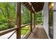 This stunning porch offers breathtaking views of the property's lush surroundings at 1461 Bubbling Creek Ne Rd, Brookhaven, GA 30319