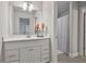 Bathroom featuring a white vanity and a shower at 33 Vinery Ct, Sharpsburg, GA 30277