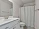 Bathroom featuring a sink, toilet and shower at 33 Vinery Ct, Sharpsburg, GA 30277