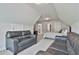 Spacious bedroom featuring vaulted ceilings and gray sofas at 33 Vinery Ct, Sharpsburg, GA 30277