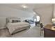 Comfortable bedroom with neutral colored walls, large bed, sitting area and a desk at 33 Vinery Ct, Sharpsburg, GA 30277