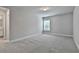 Bedroom with a window and carpeted floor at 33 Vinery Ct, Sharpsburg, GA 30277