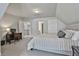 Bedroom with a bed, desk, and access to other rooms at 33 Vinery Ct, Sharpsburg, GA 30277