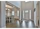 Elegant entryway with hardwood floors, coffered ceiling, and dining area at 33 Vinery Ct, Sharpsburg, GA 30277