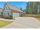 Driveway and garage of a two-story home with a fenced backyard at 33 Vinery Ct, Sharpsburg, GA 30277