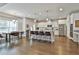 Gourmet kitchen features a large island, stainless steel appliances, and sleek white cabinets at 33 Vinery Ct, Sharpsburg, GA 30277