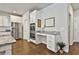 The modern kitchen has granite countertops, stainless steel appliances, and a built-in desk area at 33 Vinery Ct, Sharpsburg, GA 30277