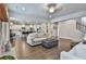 Spacious living room flows into the kitchen, with hardwood floors, and a stone fireplace at 33 Vinery Ct, Sharpsburg, GA 30277