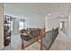 Upstairs loft with iron railing and view of the comfy seating area at 33 Vinery Ct, Sharpsburg, GA 30277