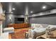 Finished basement featuring a fireplace, large sectional sofa, stylish decor, and TV at 5545 Cross Gate Ct, Atlanta, GA 30327