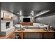 Finished basement featuring a fireplace, large sectional sofa, and stylish decor throughout at 5545 Cross Gate Ct, Atlanta, GA 30327