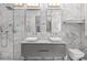 Modern bathroom features double vanity, a glass-enclosed shower, and sleek marble finishes at 5545 Cross Gate Ct, Atlanta, GA 30327