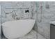 Beautiful bathroom featuring a soaking tub, marble accents, and modern fixtures at 5545 Cross Gate Ct, Atlanta, GA 30327