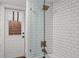 Modern bathroom featuring subway tile, glass shower, and bronze fixtures and a door to the exterior at 5545 Cross Gate Ct, Atlanta, GA 30327