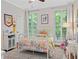A bedroom with bright beddings, white furniture and ample natural light at 5545 Cross Gate Ct, Atlanta, GA 30327