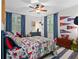 A bedroom with fun pattern bedding, blue accents and playful decor at 5545 Cross Gate Ct, Atlanta, GA 30327