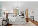 Tranquil bedroom featuring hardwood floors, natural light, and tasteful decor at 5545 Cross Gate Ct, Atlanta, GA 30327