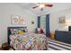 A bedroom with fun pattern bedding, blue accents and playful decor at 5545 Cross Gate Ct, Atlanta, GA 30327