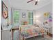 A bedroom with bright beddings, white furniture and ample natural light at 5545 Cross Gate Ct, Atlanta, GA 30327