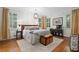 Relaxing bedroom features a king-size bed, hardwood floors, and an elegant chandelier at 5545 Cross Gate Ct, Atlanta, GA 30327